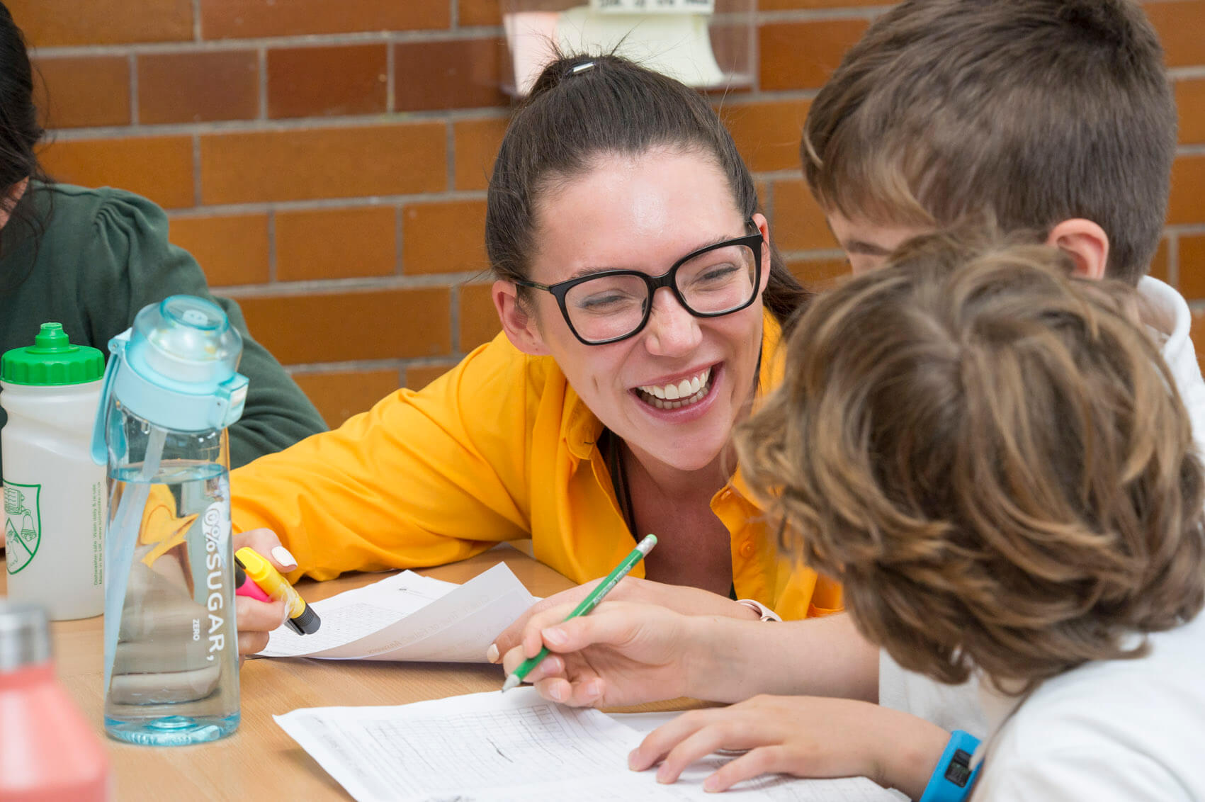 Primary school teaching laughing with pupils 